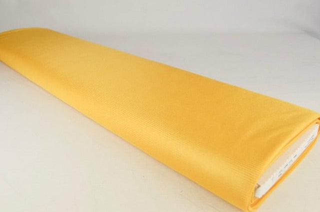 Mörkgul charmeuse foder med stretch (bild 2 av 2)