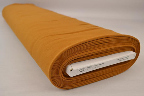 Mörk okergul french terry – mjuk bomullsstickad metervara med stretch (bild 2 av 5)