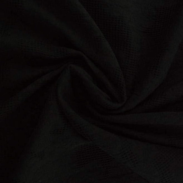 Svart bomulls jacquard – våffelstruktur med blommotiv (bild 1 av 5)