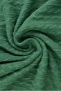 Mörkgrön kabelstickad jacquard (bild 1 av 2)