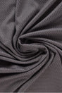 Mörkgrå polyamid-elastanjersey med sillbensmönster, draperat (bild 1 av 7)