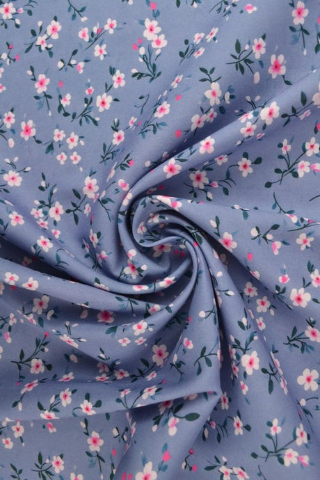 Ljusblått & rosa viscosetyg med smått blommtryck (bild 1 av 9)