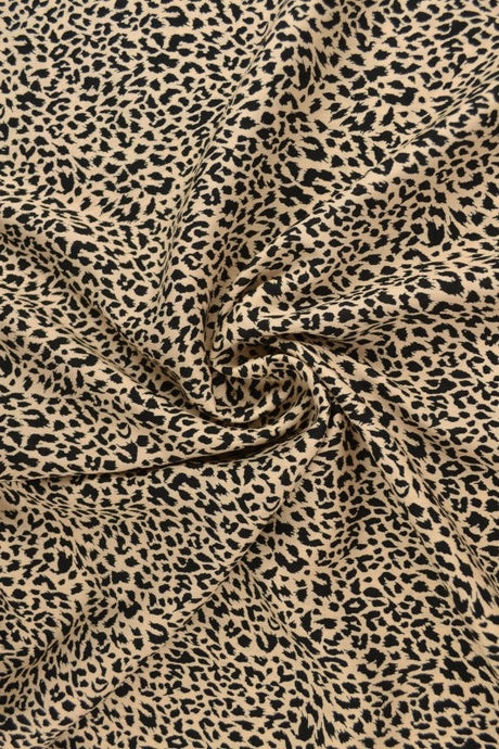 Beige & svart viscosetyg med mini leopardtryck (bild 1 av 9)